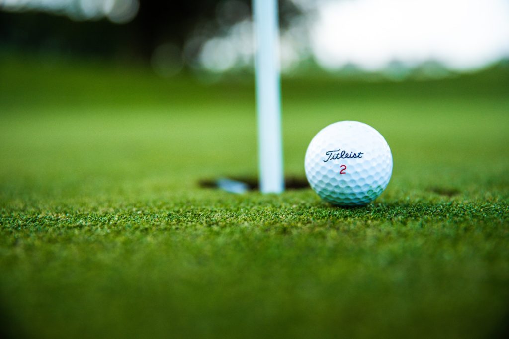 a photo of a golf ball near the hole