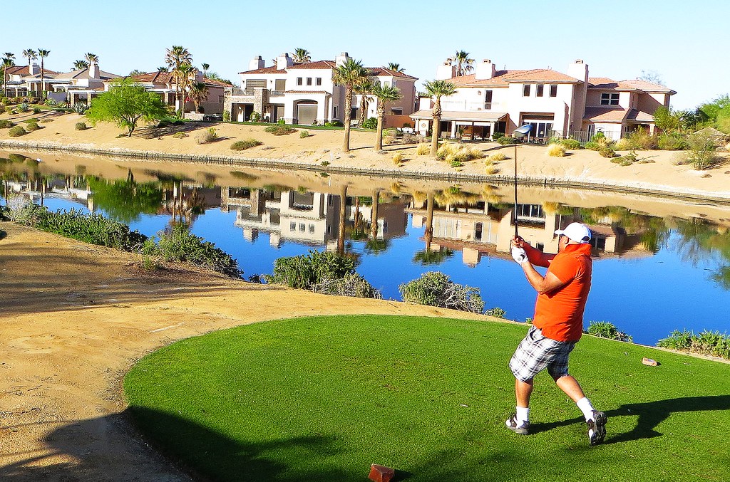 a photo of a man hitting the golf ball in Spanis Trails Country Club