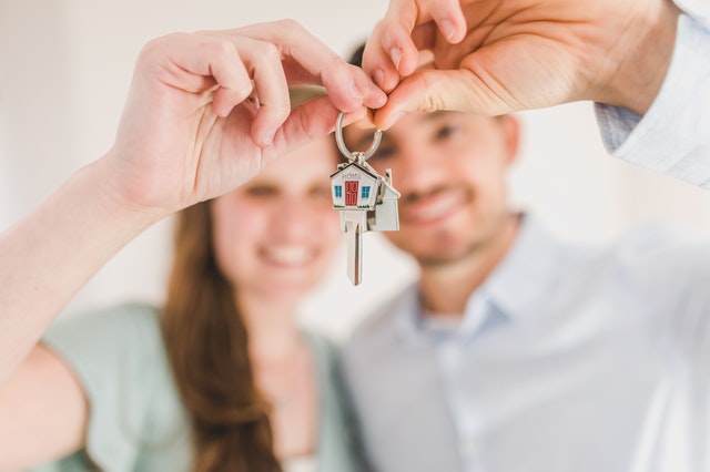 Young Couple Holding the Key to Their New Las Vegas Home