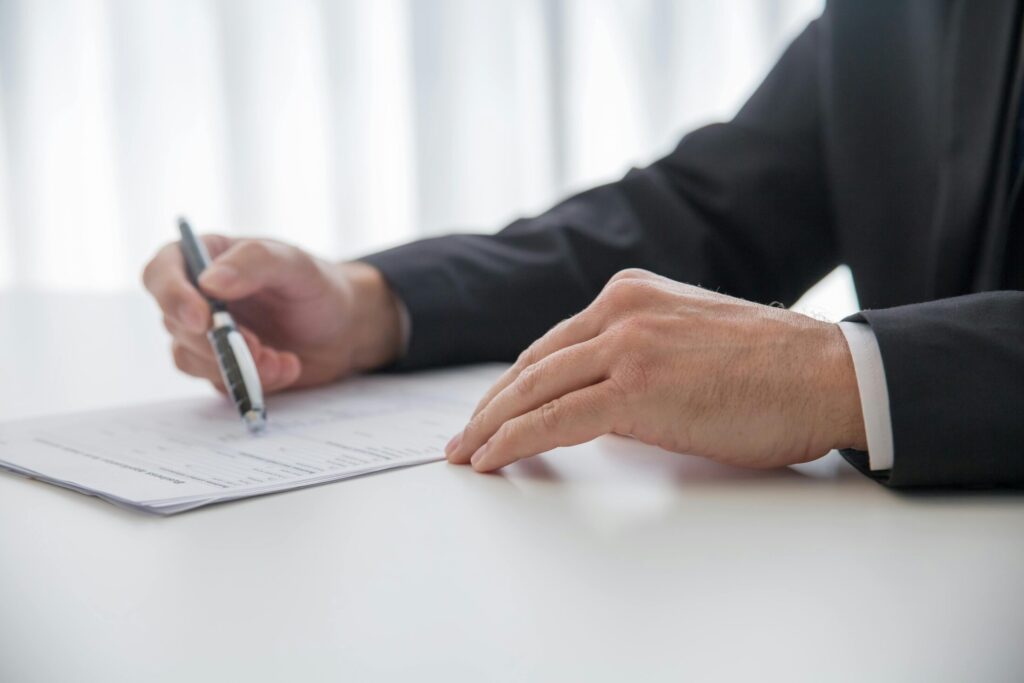 a person holding a pen