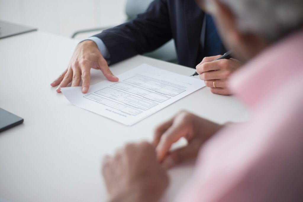 a man signing a document