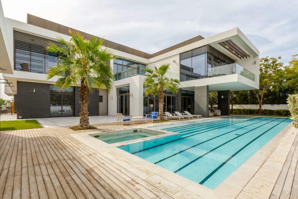 white and brown concrete building near the swimming pool